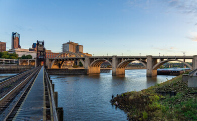 Early morning cityscape of St Paul and Twin Cities in Minnesota and Mississippi river with railroad...