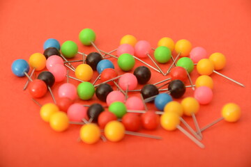 A colorful bunch of pins adds a lively touch to your stationery collection