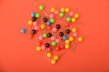 A colorful bunch of pins adds a lively touch to your stationery collection