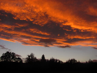 Fototapeta na wymiar Orange clouds in the sky after sunset