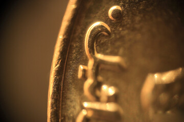 Engraved Jewish metal symbols on an Israeli coin in close-up	
