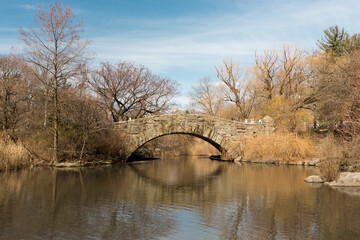 On a sunny winter morning at the Gapstow Bridge, one of the icons of Central Park, Manhattan, New York City