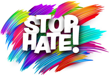 Stop hate paper word sign with colorful spectrum paint brush strokes over white.