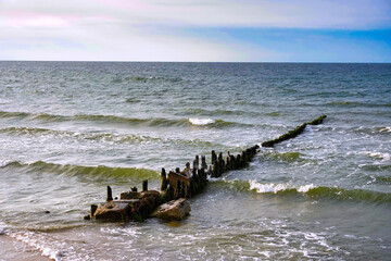 Sea waves crashing against the breakwater.