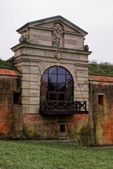 Old Lublin gate (Brama Lubelska) of fortress in Zamosc, Poland. Ancient fortification brick wall.