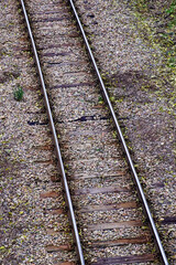 Railway bed. Fragment of railway tracks, top view, rails and sleepers.