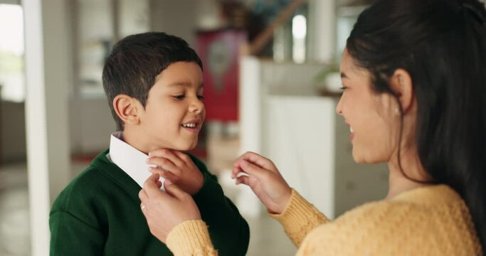School, dressing and mother high five child in home ready for education, childhood development and learning. Happy, family and mom and young boy for greeting, goodbye and care leaving for academy