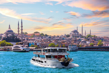 Famous Suleymaniye and Rustem Pasha Mosques and the cruise boat on the Bosphorus, popular place of...