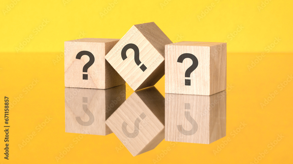 Poster three wooden blocks with questions mark on yellow background. reflection of an image on a glass surf