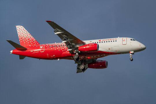 SAINT PETERSBURG, RUSSIA - MAY 30, 2023: Airplane Sukhoi SuperJet 100-95B "Klin" (RA-89123) of Rossiya airlines close-up in a cloudy gloomy sky