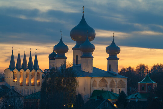 The old Assumption Cathedral of the Tikhvin Assumption Monastery against the background of the cloudy October sunset. Tikhvin, Leningrad region. Russia