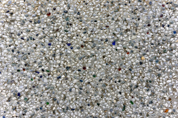 Varied Pebbles Embedded in Concrete. A Detailed Texture of Mixed Stones and Aggregate.