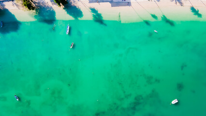 Aerial view of the beach. Comfortable for the eyes. Beautiful coastal sea and open sea in summer, nature recovers environment and tourism background, at Ao Yon Phuket Thailand.