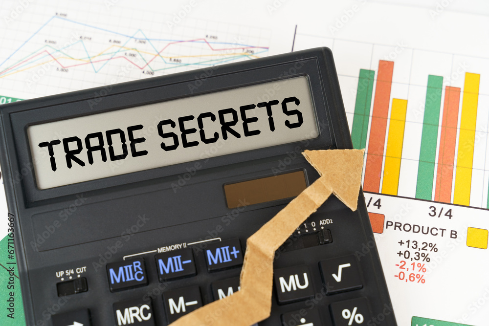 Poster on the business charts there is a calculator on the screen with the inscription - trade secrets