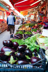 Sicily, Italy - June 22, 2022: Lots of vegetables kept on display in the grocery market of Palermo