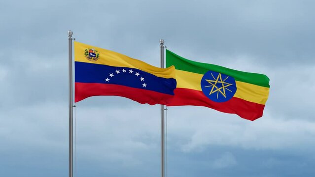 Ethiopia flag and Venezuela flag waving together on cloudy sky, endless seamless loop, two country relations concept