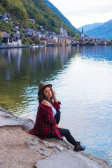 Fototapeta na wymiar Latina woman on vacation in Alps mountains in Austria. Holidays and vacation concept