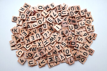 Stack of wooden letter, number, and punctuation mark blocks mixed together