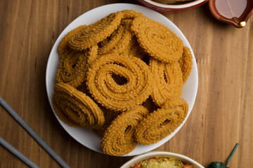 Indian Traditional Tea Time Snack Chakli, a deep fried snack, It is known as Chakali, Murukku, Muruku, Murkoo, Chakri.