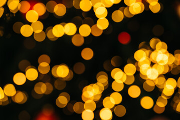 sparkling abstract bokeh background yellow color with glitter circles defocused golden particles on dark background for overlay screen. Abstract Festive vintage lights defocused.
