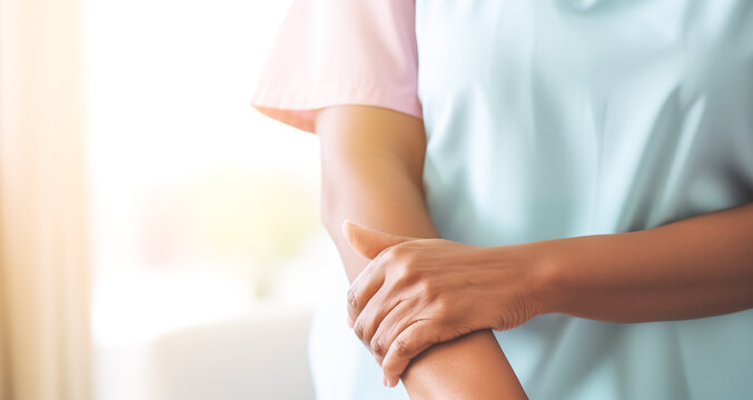 woman suffering from arm pain, painful in arm muscles. red  arm muscles on light background. health care and medical concept. 