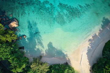 Drone bird eye view of Anse louis, Louis beach, white sandy beach, turquoise water Mahe Seychelles