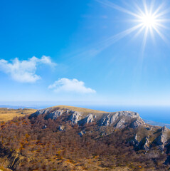 mountain ridge under a sparkle sun
