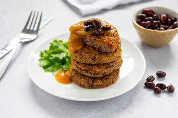 Vegan bean burgers with gravy sauce, patties or cakes, healthy alternative food