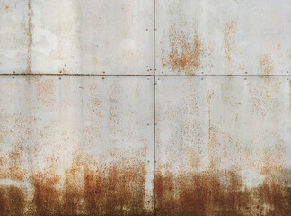 Marks and rust patterns on metal containers. Rusty corrosion and oxidized background. Worn metallic iron rusty metal background