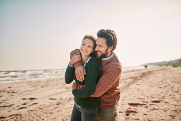 Loving couple sharing a tender moment on the beach
