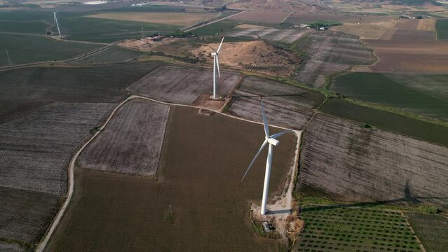 Wind turbines producing electricity in a cotton field in Dikili, Izmir province, Turkey