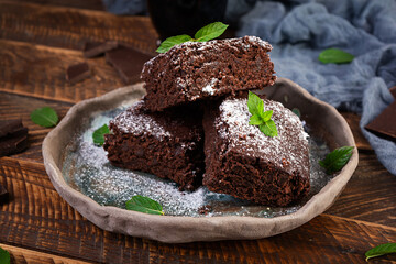Delicious dessert chocolate banana brownie. Homemade bakery, brownie with mint leaves