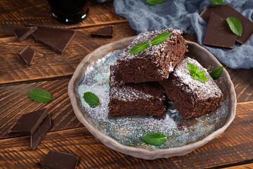 Delicious dessert chocolate banana brownie. Homemade bakery, brownie with mint leaves
