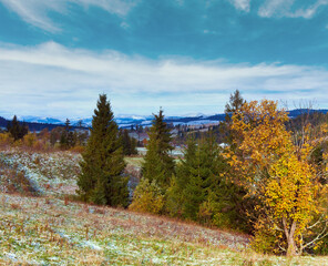 October Carpathian mountain plateau with first winter snow and autumn colorful foliage