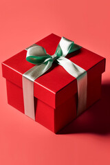 Red gift box with pink bow over red background. 