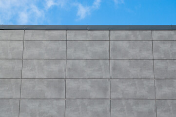 gray wall and blue sky, bottom view