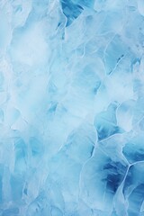 Obraz premium A detailed close-up of a surface covered in blue ice. This image can be used to showcase the beauty and texture of ice formations.