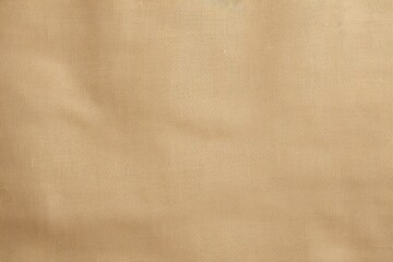 A close up view of a tan cloth against a clean white background. This versatile image can be used in various design projects