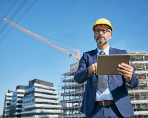 businessman construction site business architect building engineer builder tablet helmet architecture blueprint worker man contractor adult engineering industry