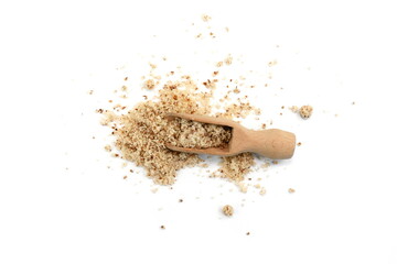 Shelled and ground Ground, milled, crushed almond nuts in a  wooden scoop isolated on white....