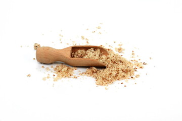 Shelled and ground Ground, milled, crushed almond nuts in a  wooden scoop isolated on white....