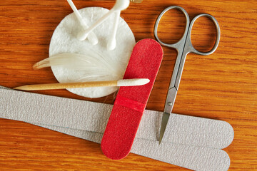 Flat lay with manicure tools set, scissors, nail file, cotton swabs. Cosmetics equip. Body care and...