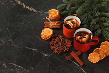 Strong alcoholic or non-alcoholic cocktail in iron mugs, mulled wine with spices, star anise,...