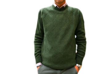 model wearing green crew neck sweater made of wool on isolated background