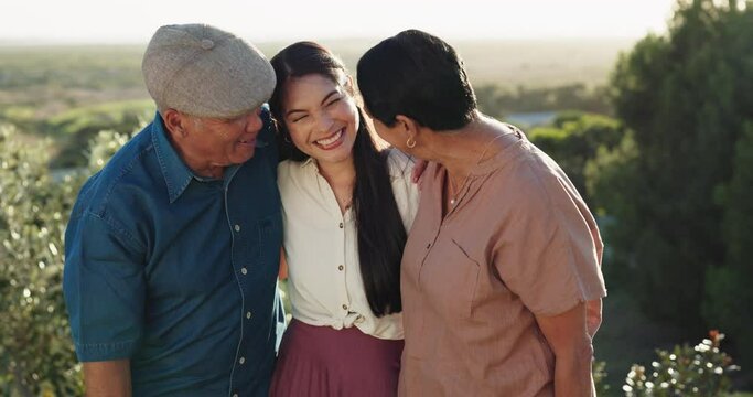 Nature, laugh and woman with her senior parents in conversation with a comic, funny or comedy joke. Happy, smile and elderly people bonding and embracing their adult daughter in an outdoor garden.