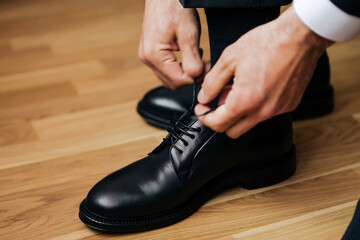hand holding shoes