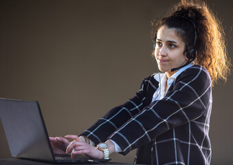 Girl with headphones and microphone working as client support