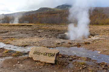 dormant little geysir at iceland with steam horizontal