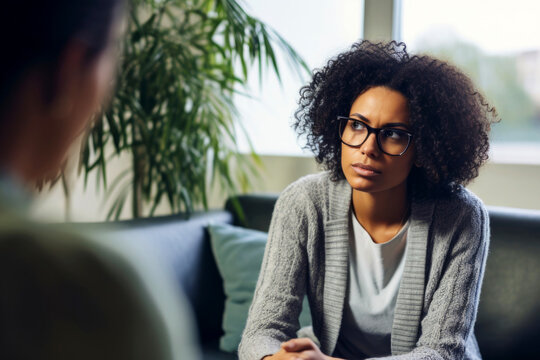 A pensive female patient consults with her therapist, sharing her innermost thoughts and feelings