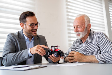 Farmer investing in new agricultural machines and farming equipment.